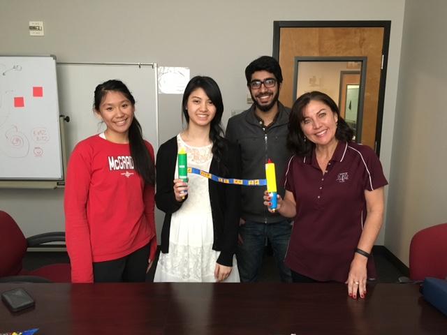 Team "Veggie Roll" and their CDF Mentor showing the seed spacing device they designed for kids. 