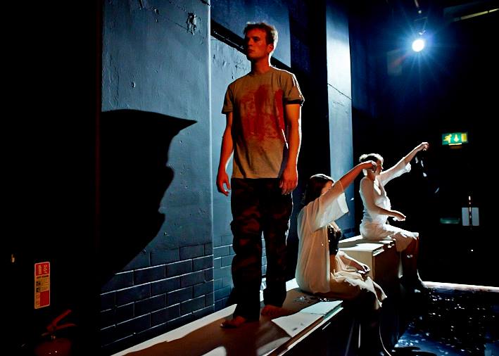 Emily as part of the onstage choir in August012's Roberto Zucco (2014, Chapter Arts Centre). Pictured with Adam Redmore (Zucco). Photography by JORGE LIZALDE.