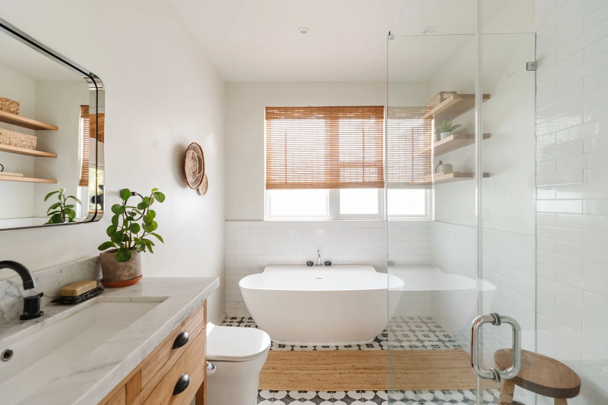 Primary bathroom at 4128 Baywood St with freestanding tub, walk-in shower, marble finishes, and modern fixtures in Atwater Village.