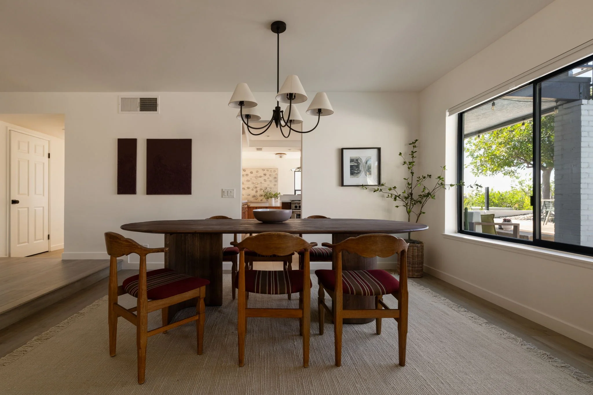 Open concept kitchen and dining area with sliding doors to outdoor space in Silver Lake home