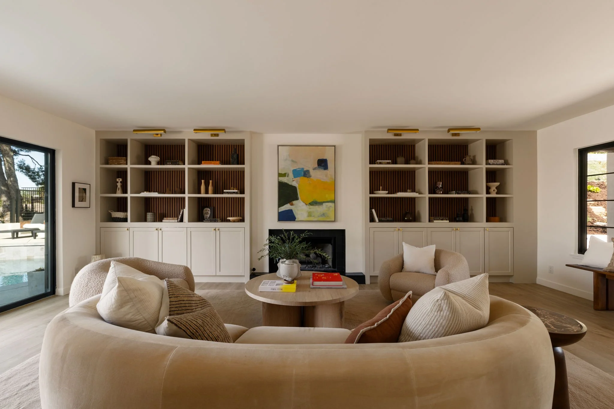 Living room with fireplace and custom bookcases at 1721 McCollum St Silver Lake home