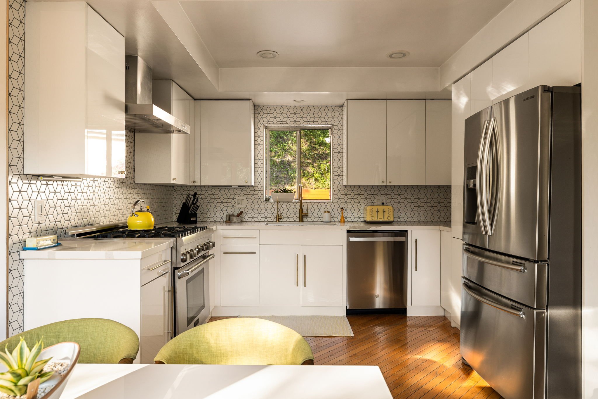 Remodeled kitchen with modern cabinetry and tile backsplash in mid-century home at 941 Cavanagh Rd Glendale