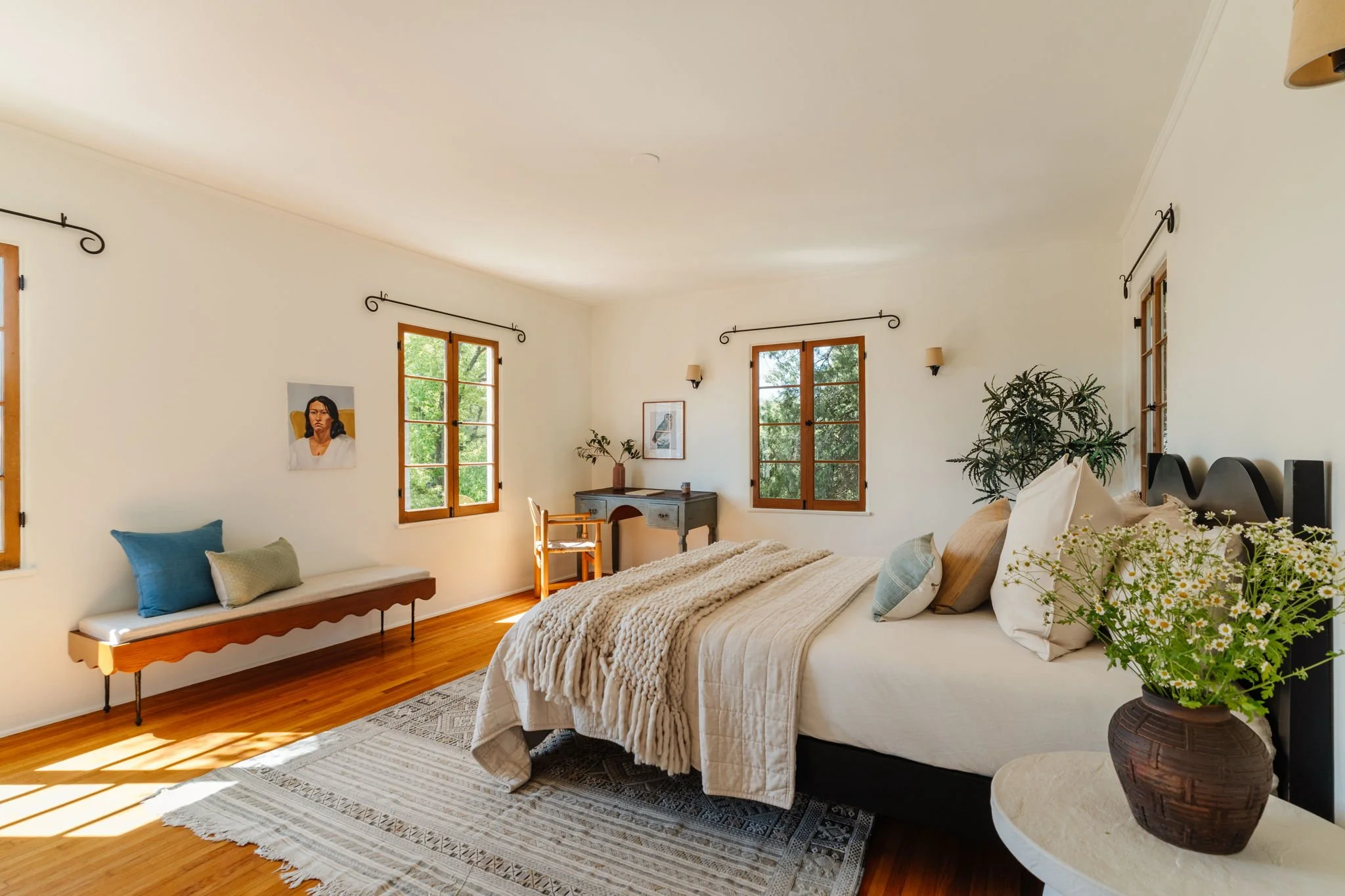 Bright bedroom with city views and original wood windows in Silver Lake Spanish home