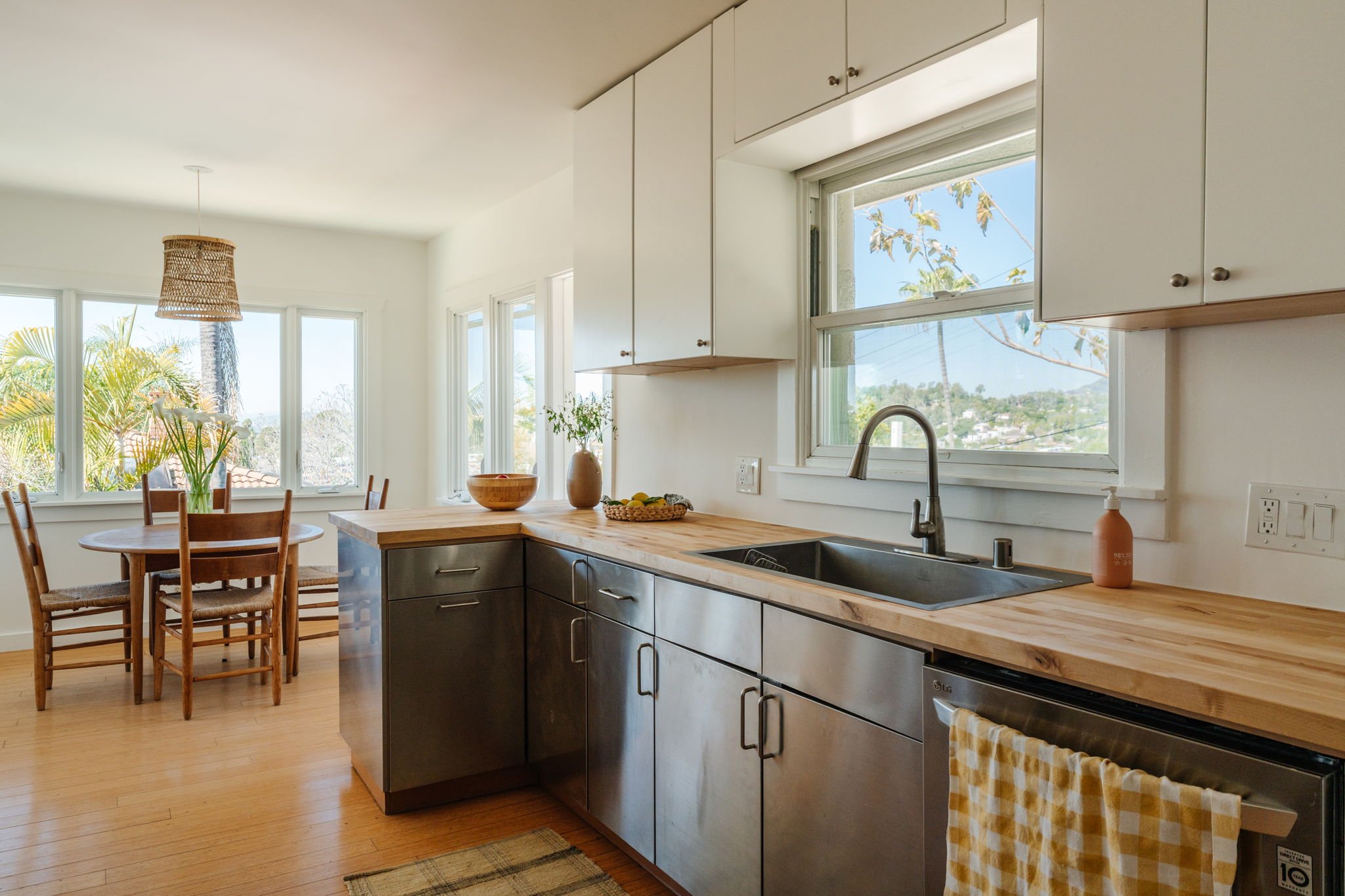 Updated kitchen with butcher block counters and breakfast nook in Highland Park craftsman