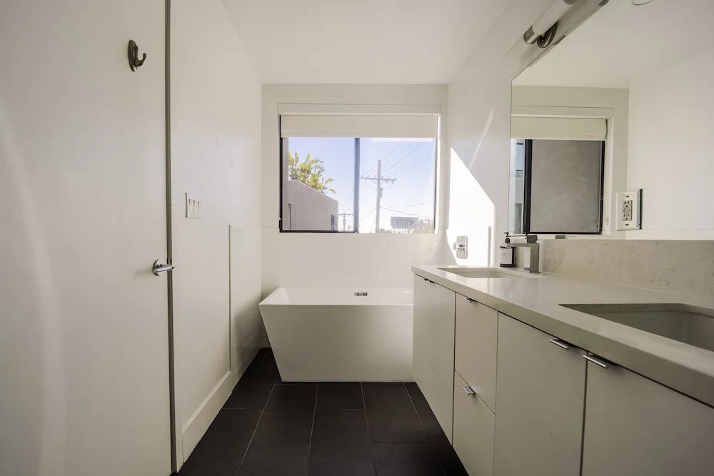 Spa-inspired primary bathroom with soaking tub in an Echo Park modern residence