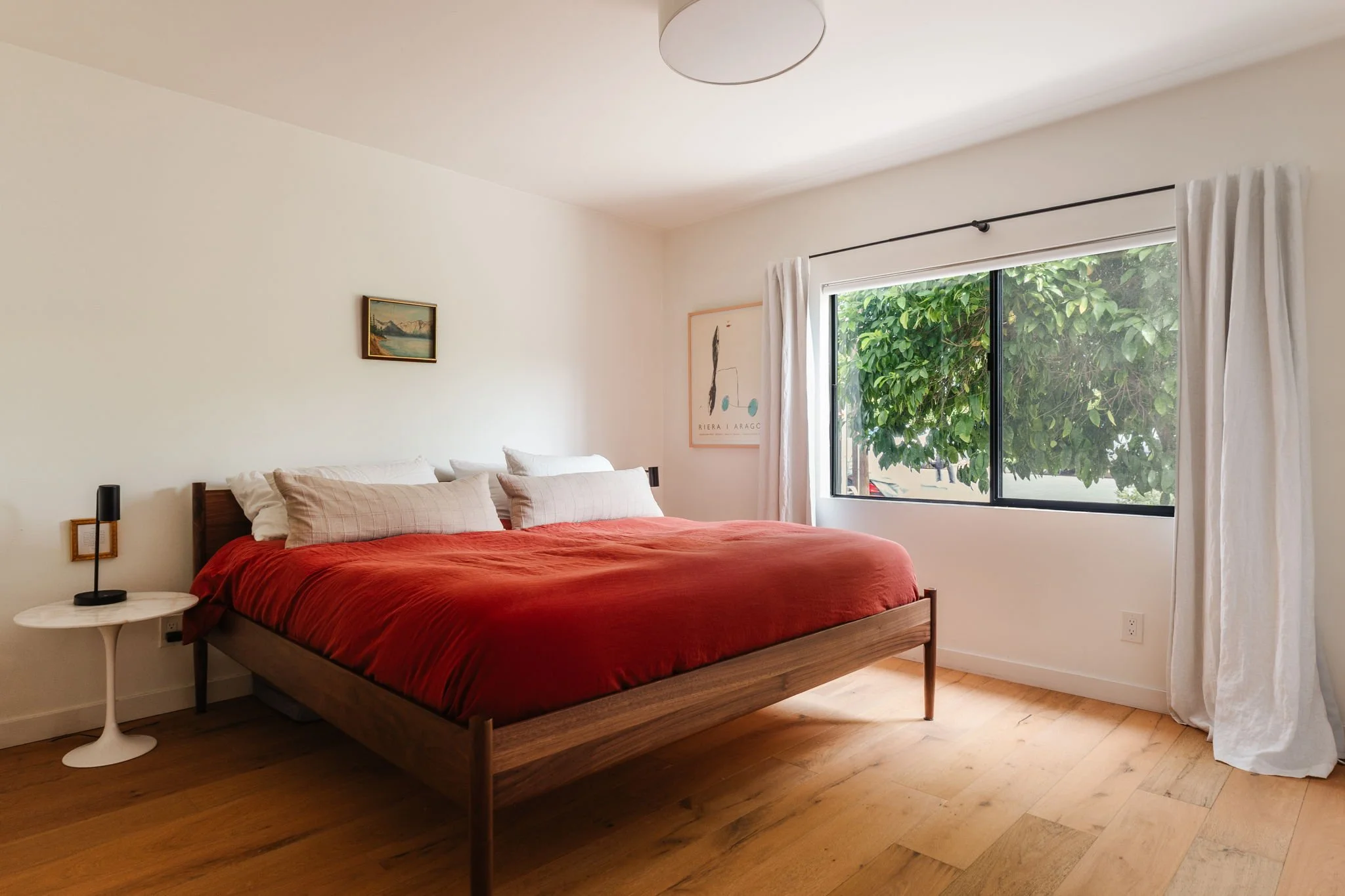 Bedroom in Highland Park home for sale with hardwood floors, natural light, and minimalist design