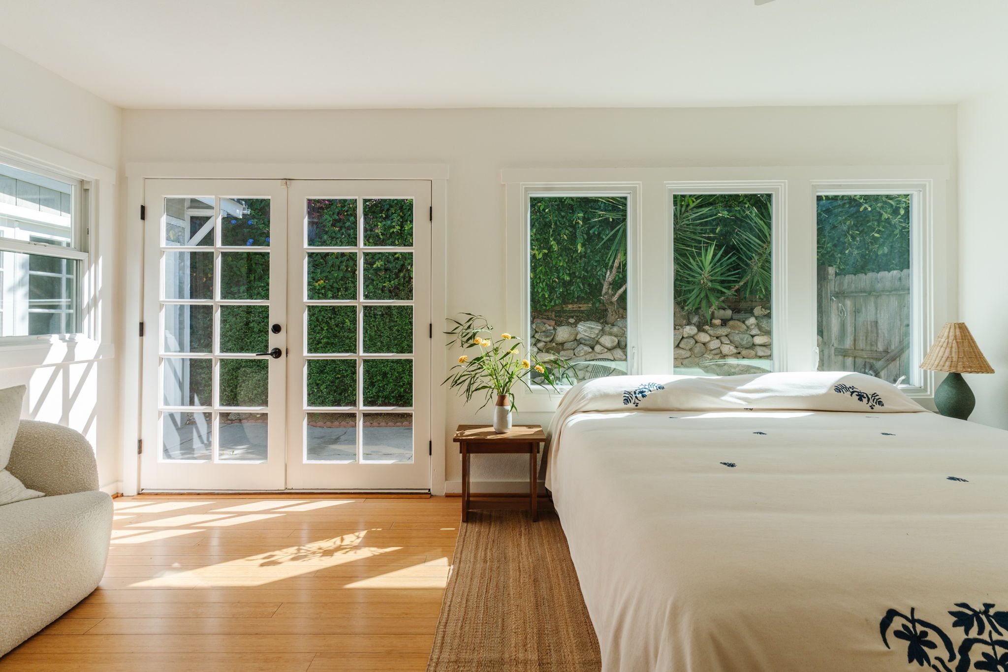 Craftsman bedroom with french doors opening to private patio in Highland Park home