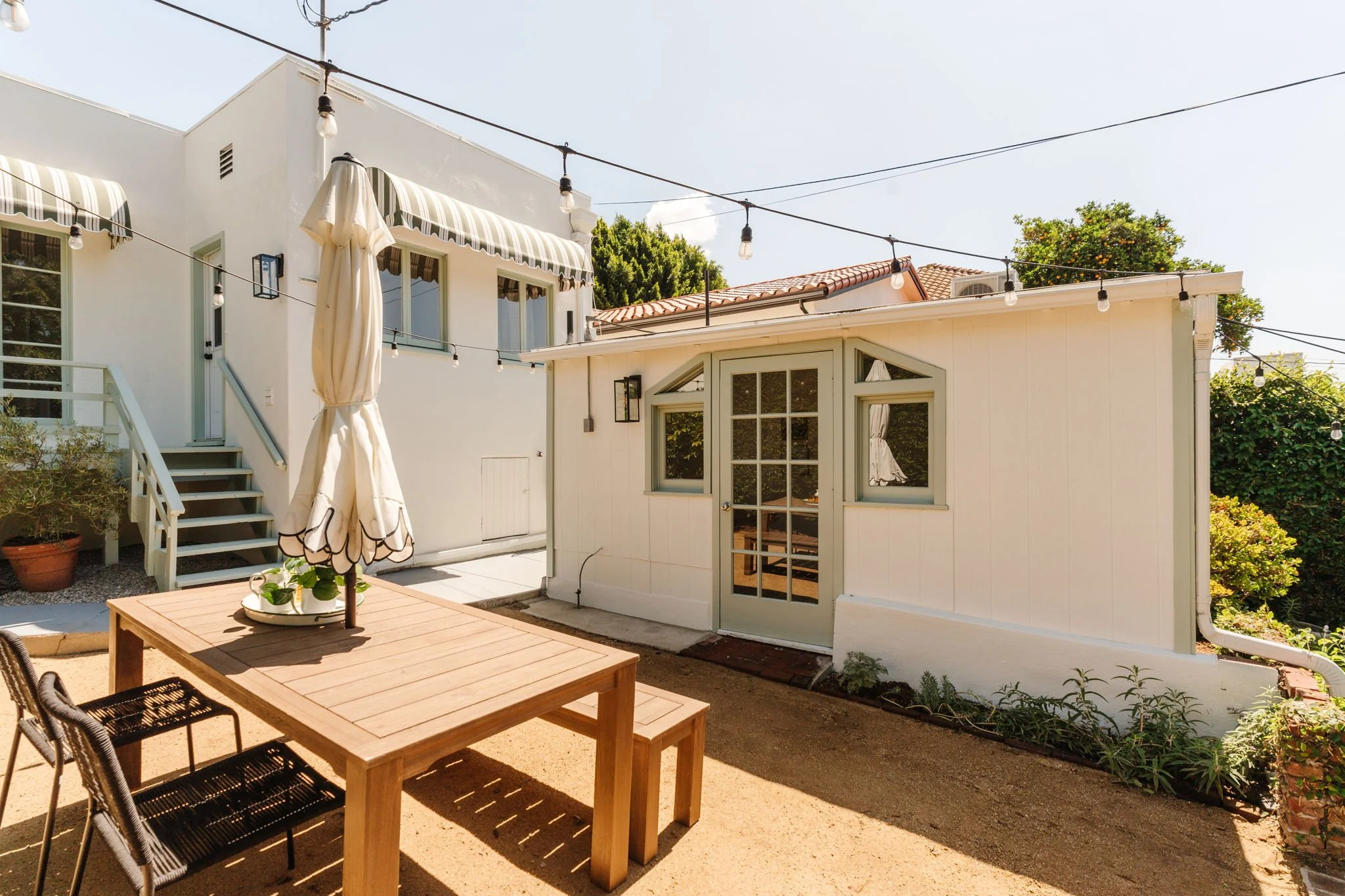 Backyard patio and detached bonus studio space at a Craftsman home in Atwater Village Los Angeles