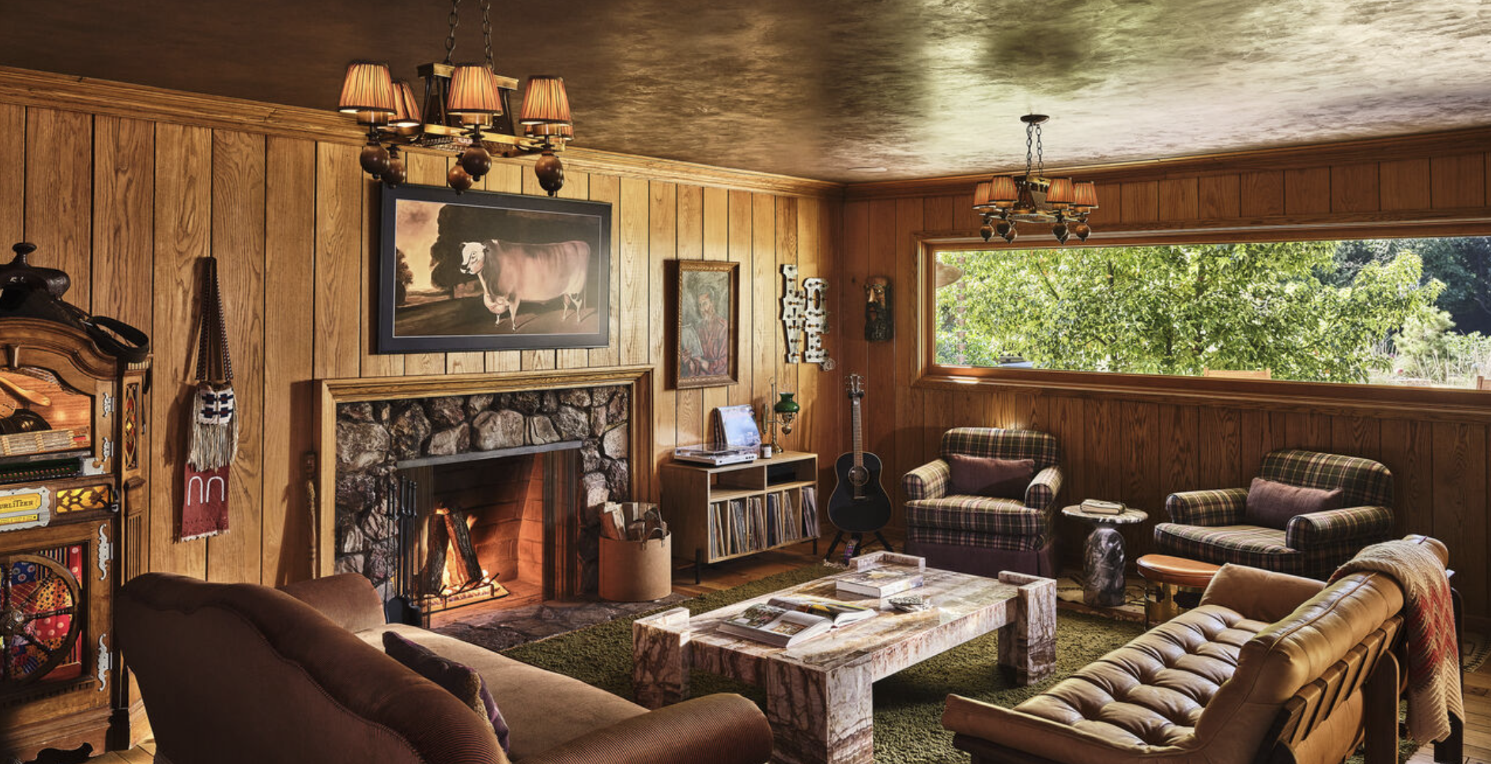1950s traditional living room in Los Feliz with wood paneling, fireplace, and vintage decor elements