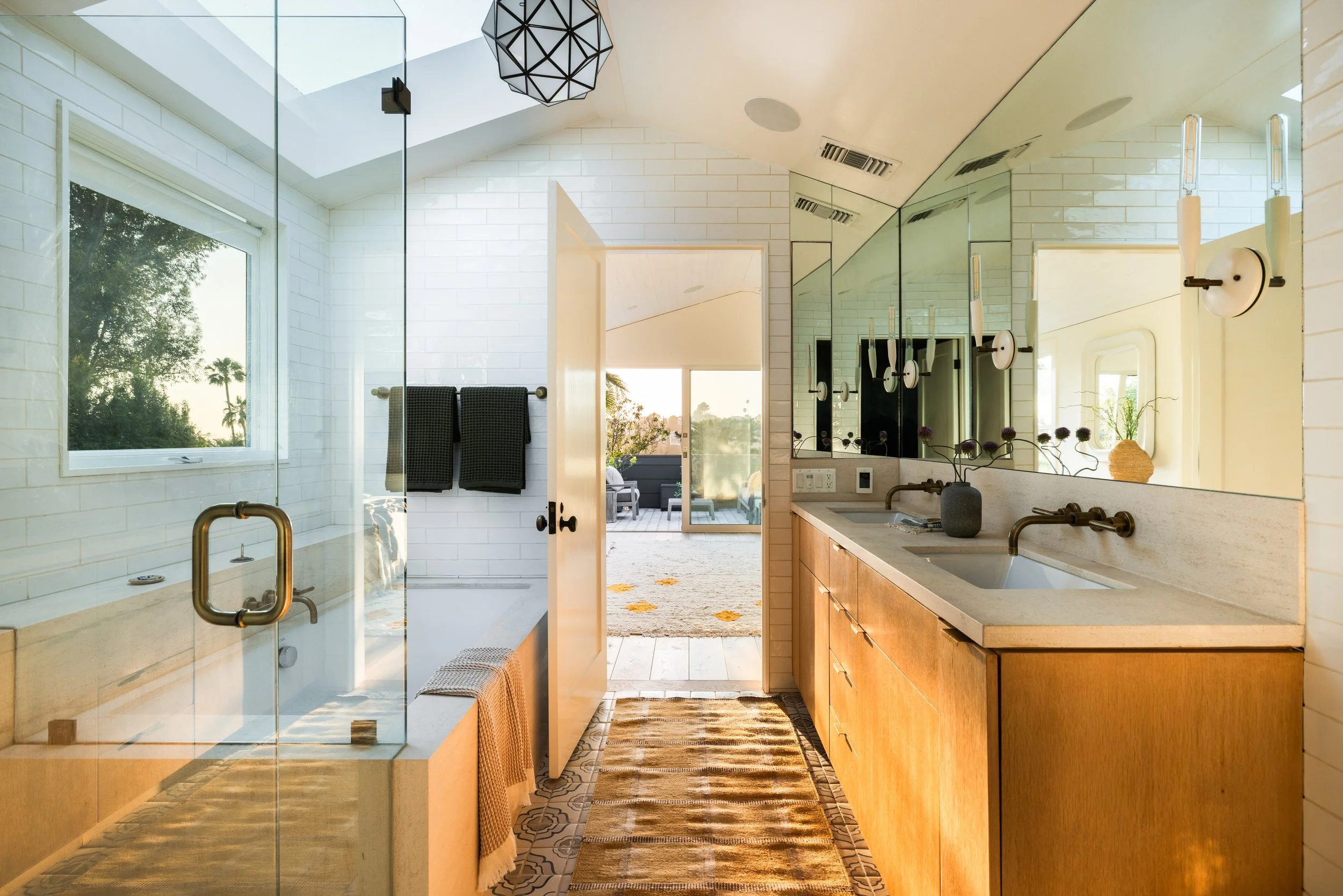 Modern home for sale in Silver Lake with bathroom, skylight, soaking tub, and dual vanity