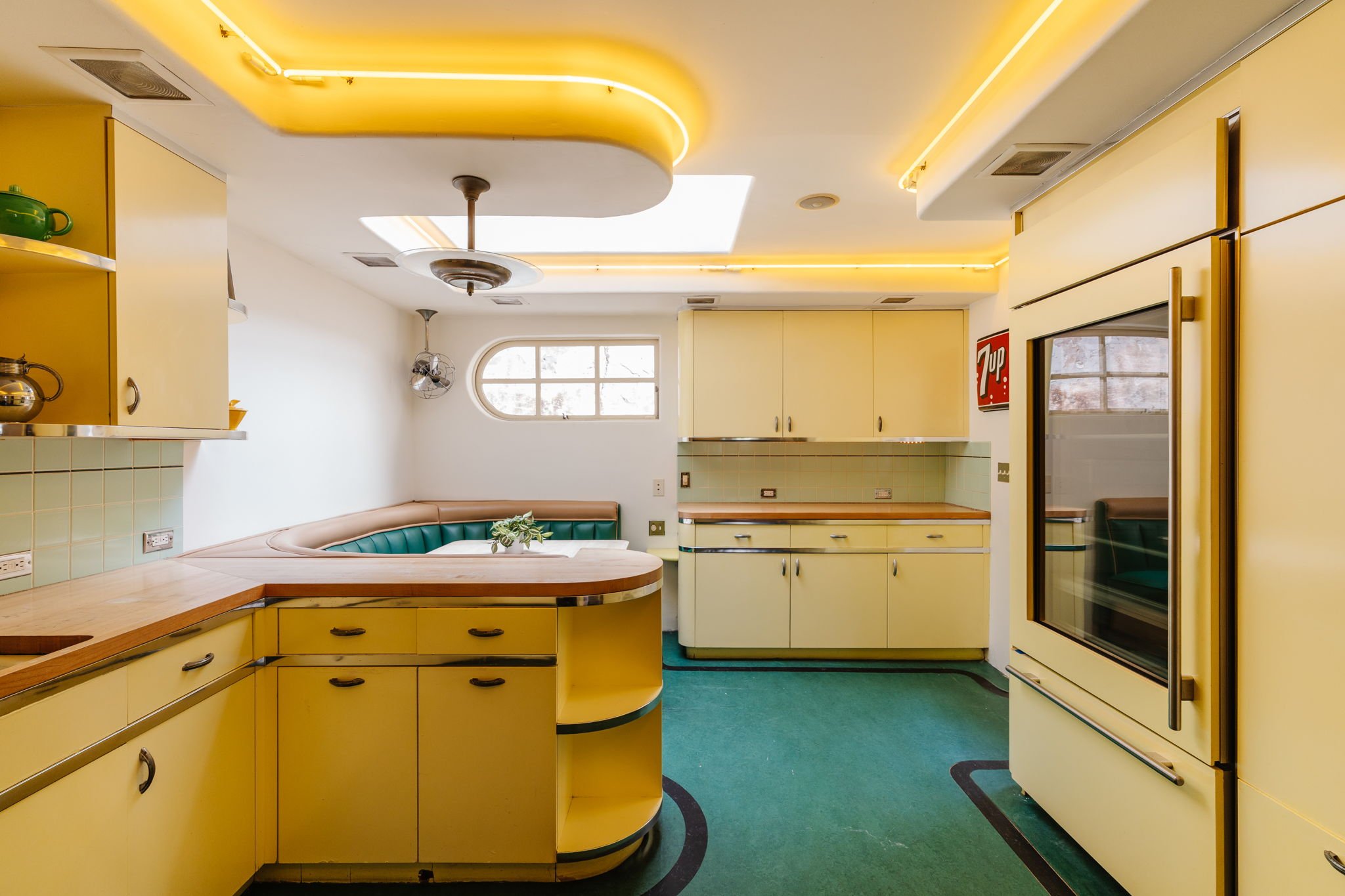 Retro eat-in kitchen with built-in breakfast nook and skylight in a 1926 Whitley Heights Spanish home