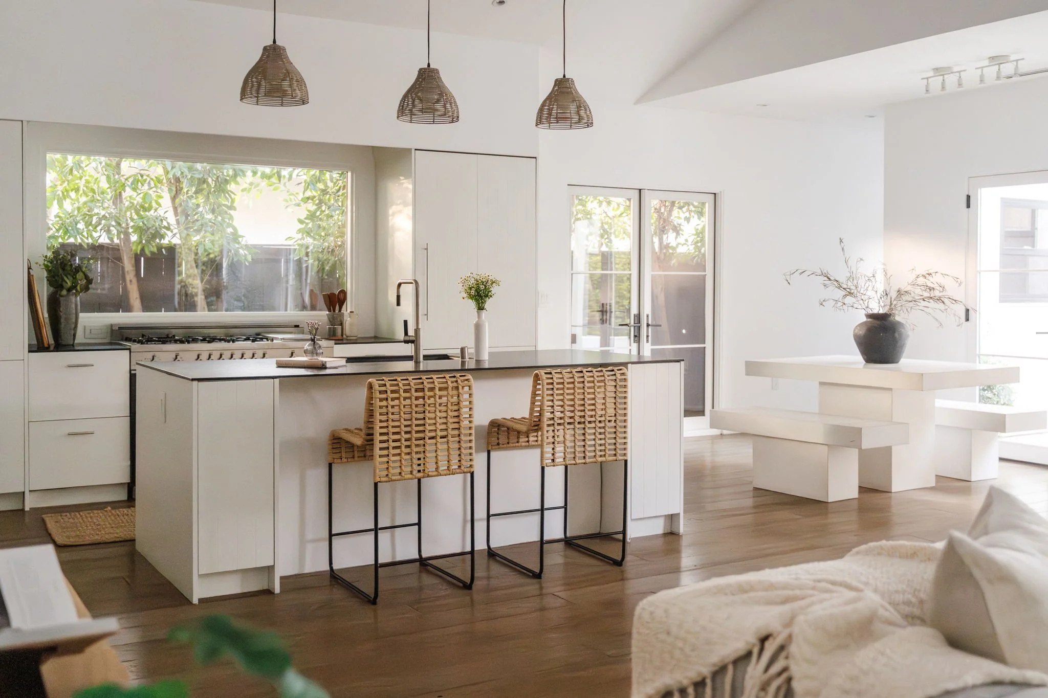 Designer kitchen at 4128 Baywood St with leathered stone island, high-end appliances, and open dining area in Atwater Village.