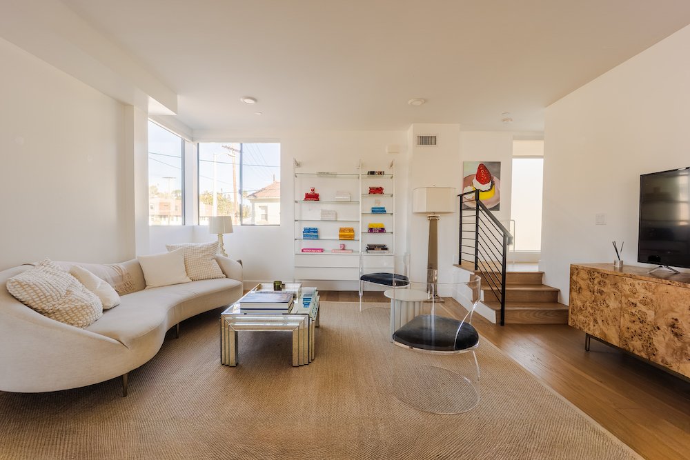 Open-concept living room with wood floors and modern design at 2176 Clifford St in Echo Park