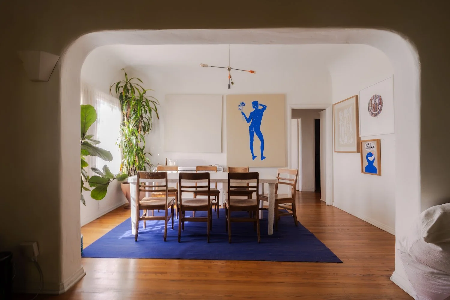 Formal dining room with arched doorway and period details inside a 1928 Beachwood Canyon fourplex