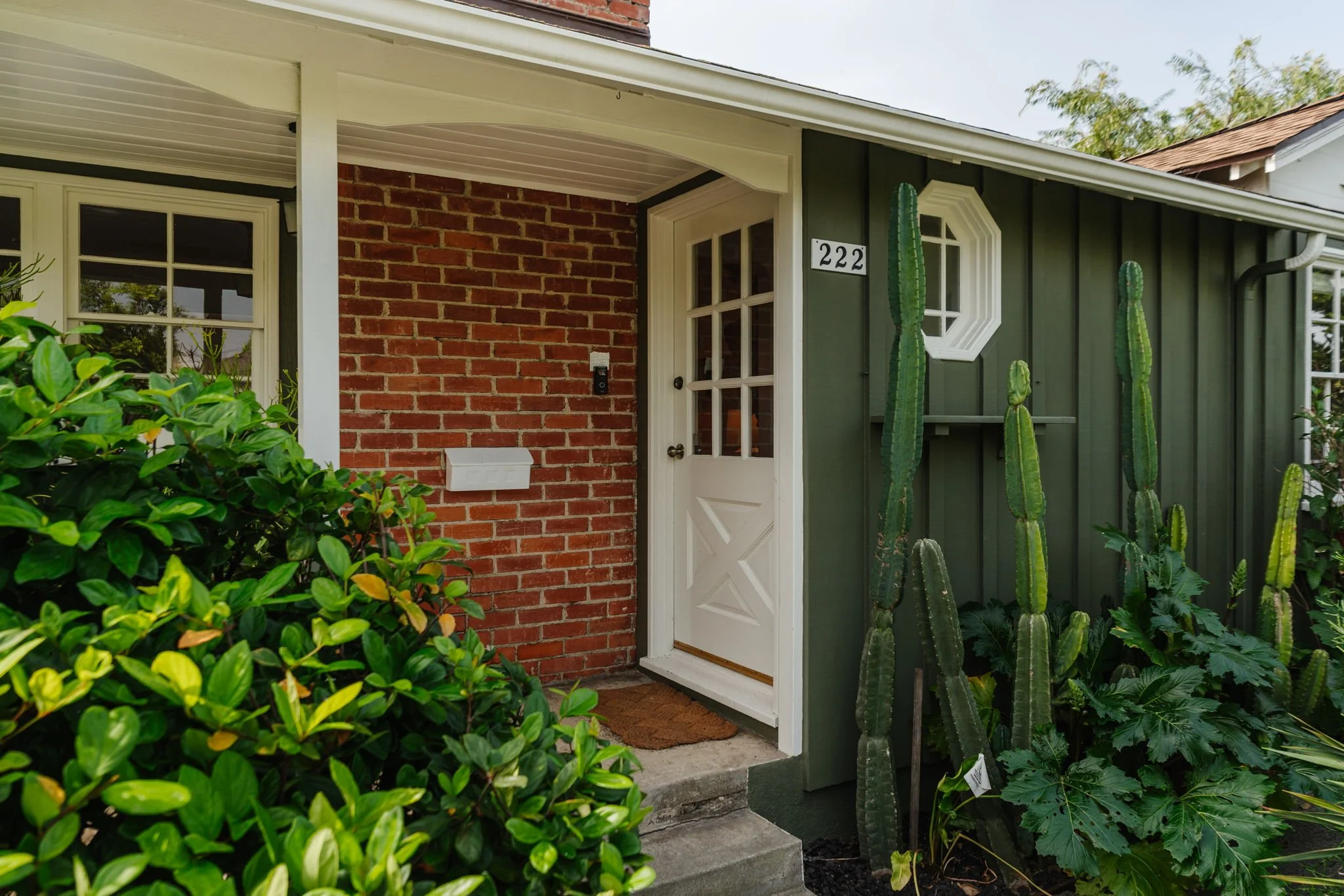 Post-war traditional home exterior in Los Angeles with landscaping and classic architectural details