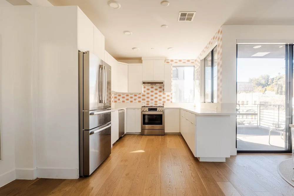 Contemporary Echo Park kitchen with custom tile backsplash and stainless steel appliances