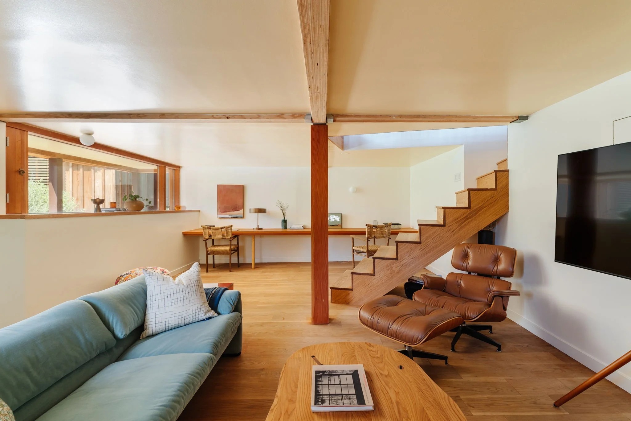 Flexible lower level living or office space with wood details in Silver Lake architectural home