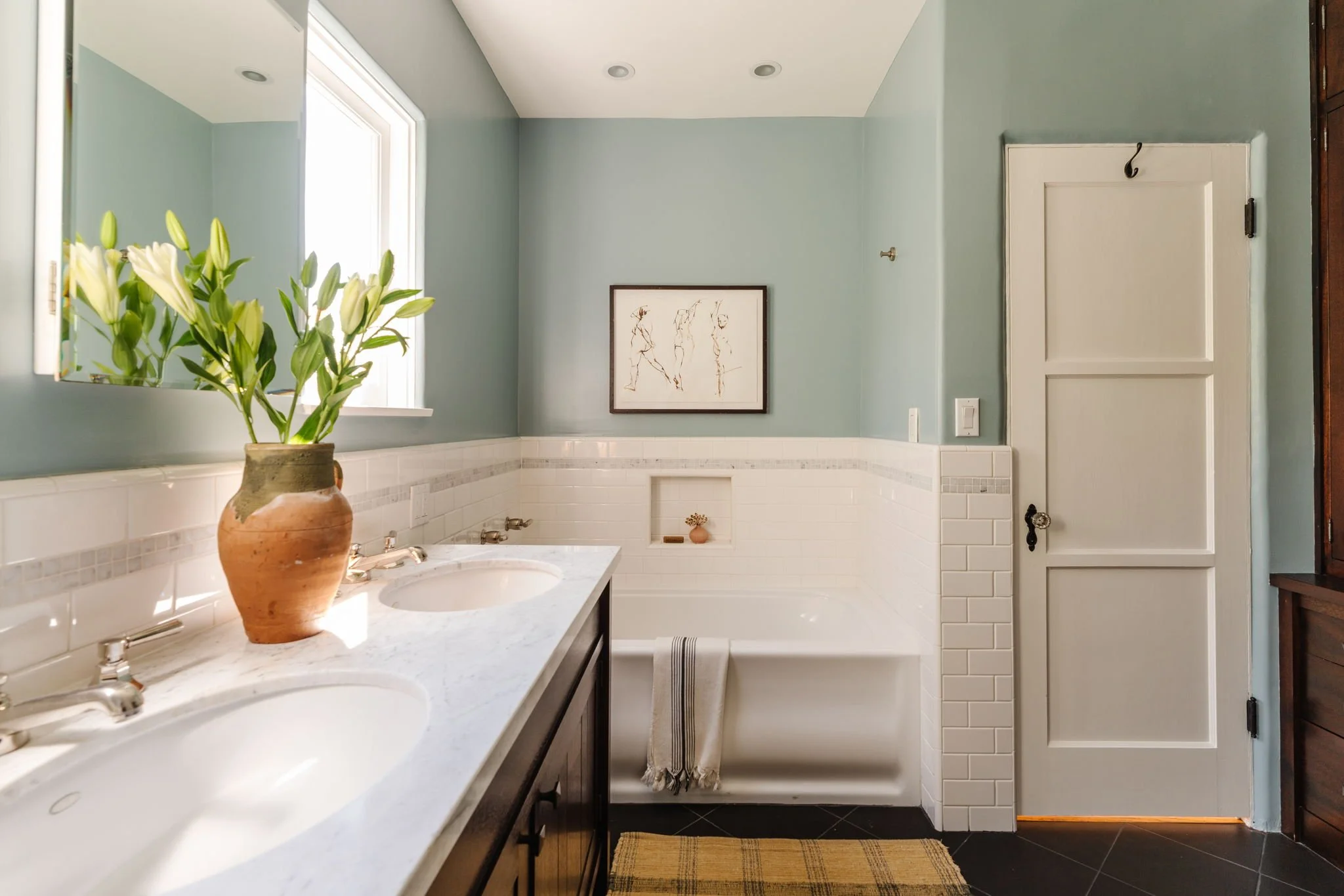 Vintage-inspired bathroom with double vanity and tile in Silver Lake Spanish home