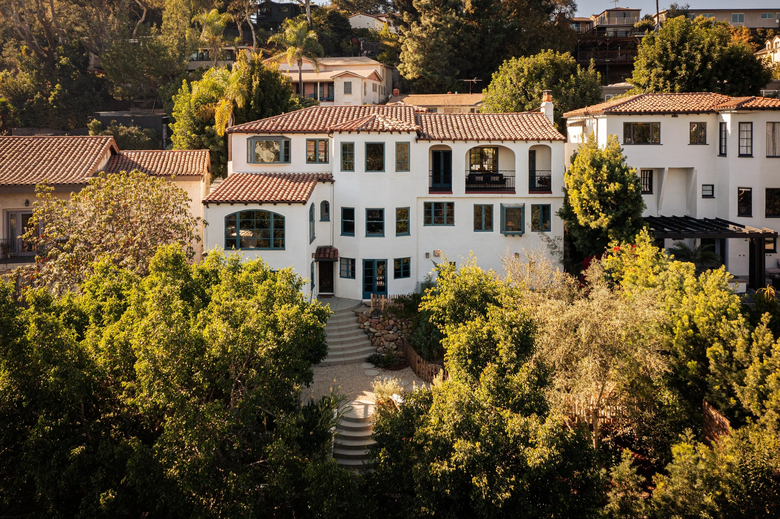 Spanish style home in Silver Lake with hillside setting and mature landscaping