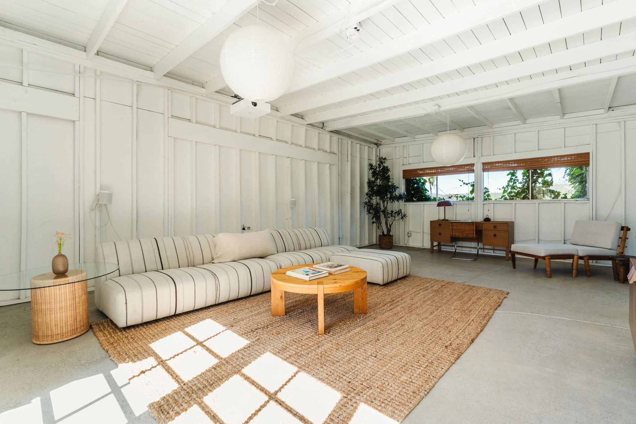 Detached garage converted to studio space with accordion doors in Highland Park home