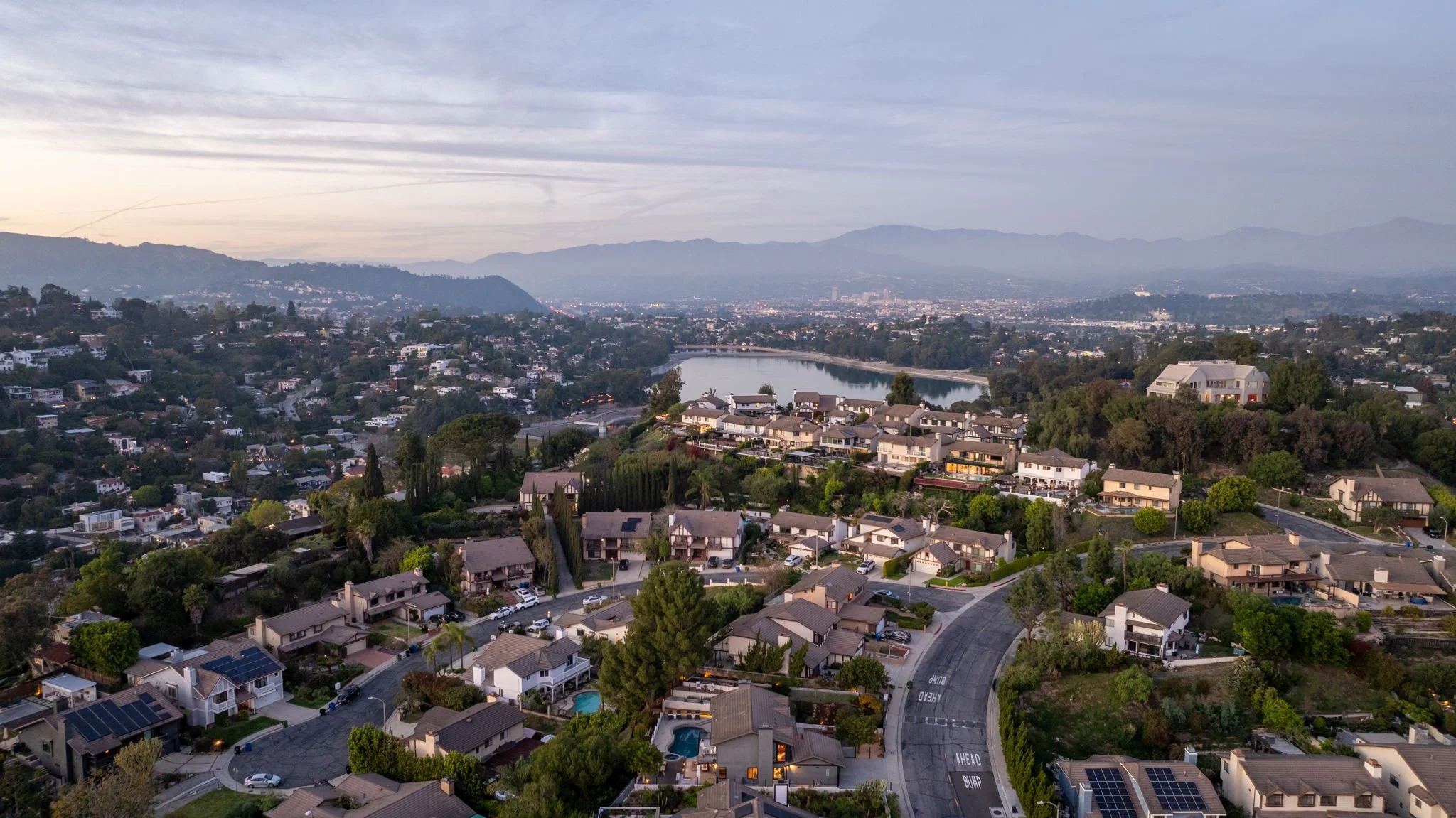 Aerial twilight view of Silver Lake hillside homes near the reservoir along Silver Lake Boulevard