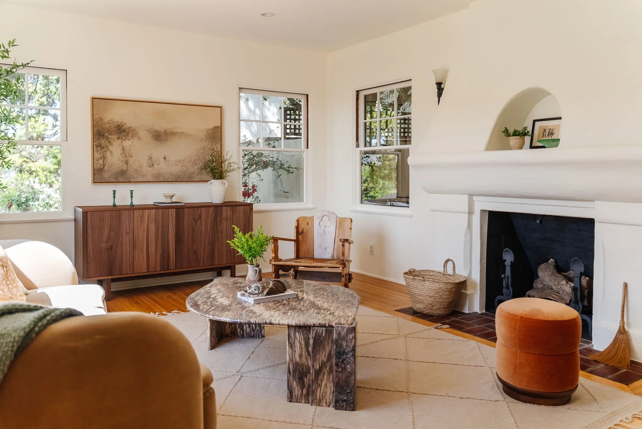 Spanish style living room with original fireplace and hardwood floors in Silver Lake home