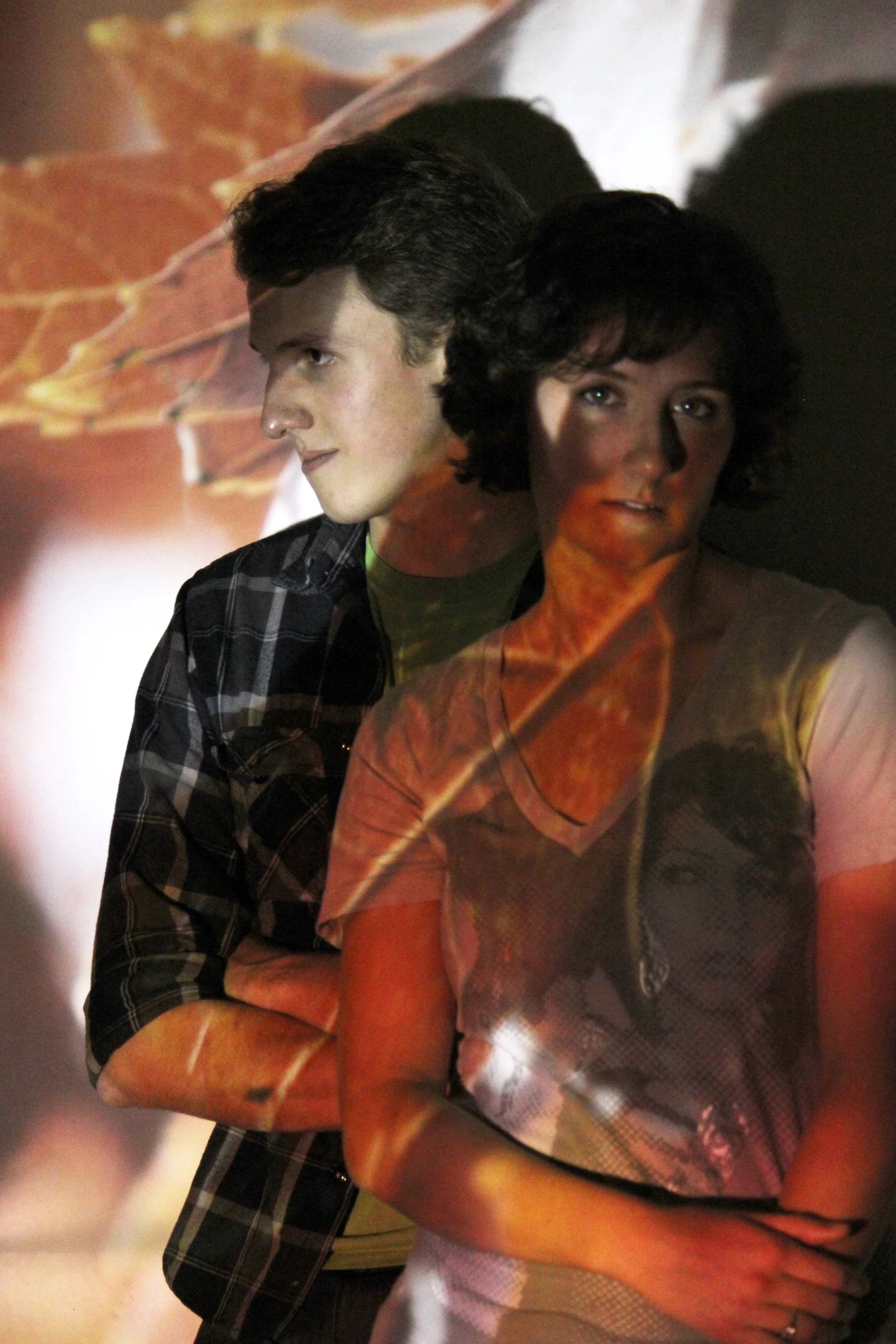 Taken with a Canon Rebel T2i and edited in Photoshop CS5. ISO 3200, f/4.5, 1/15, indoors with the lights off with a photo being projected through an opaque projector. 