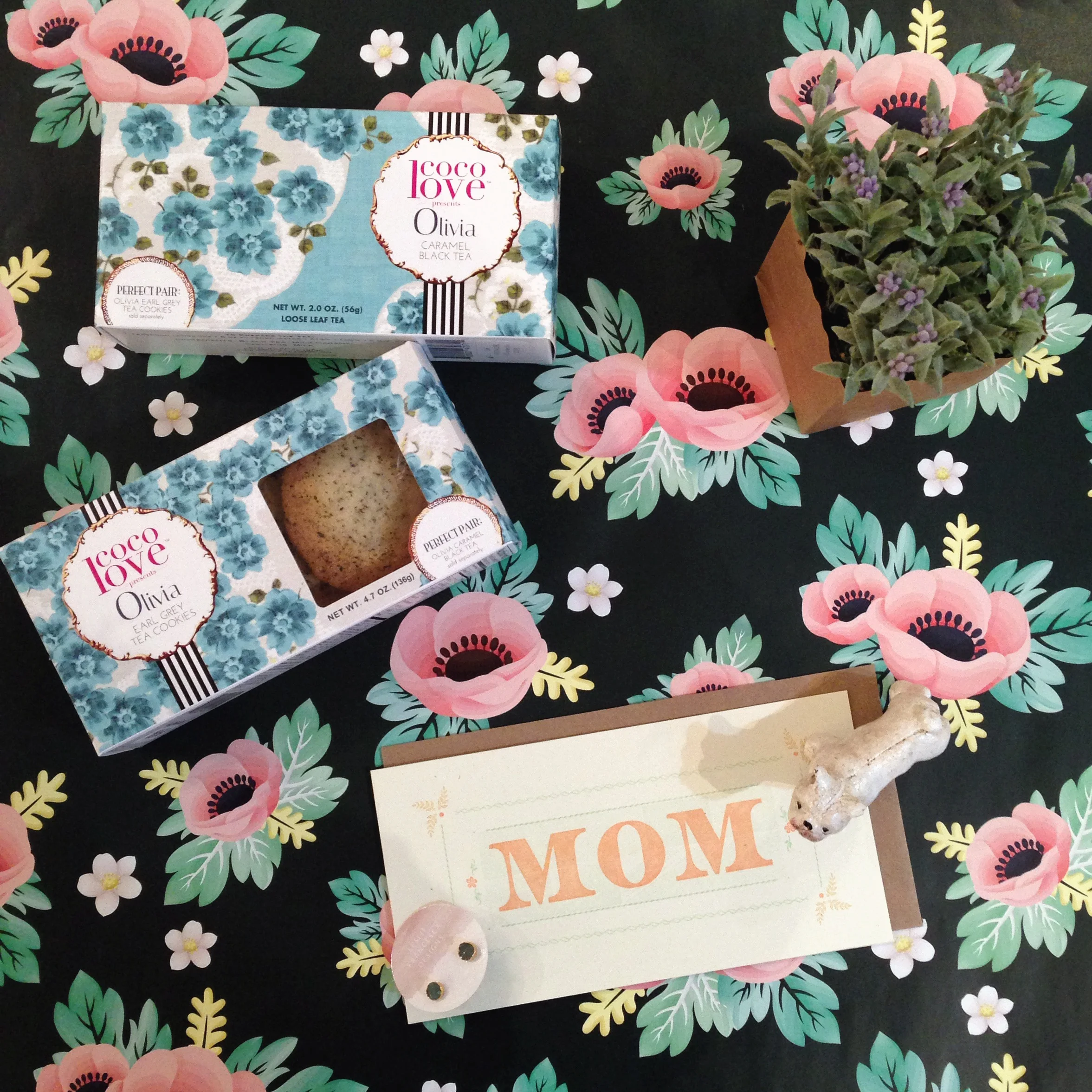 Olivia Mother's Day Gift includes: coco love Pairings Olivia Caramel Black Tea &amp; Earl Grey Tea Cookies, Gingerly Press Card, Leslie Francesca Designs Earrings, Cast Metal Bulldog, and Faux Lavender in a Bag. Decorative paper also available at Oc…