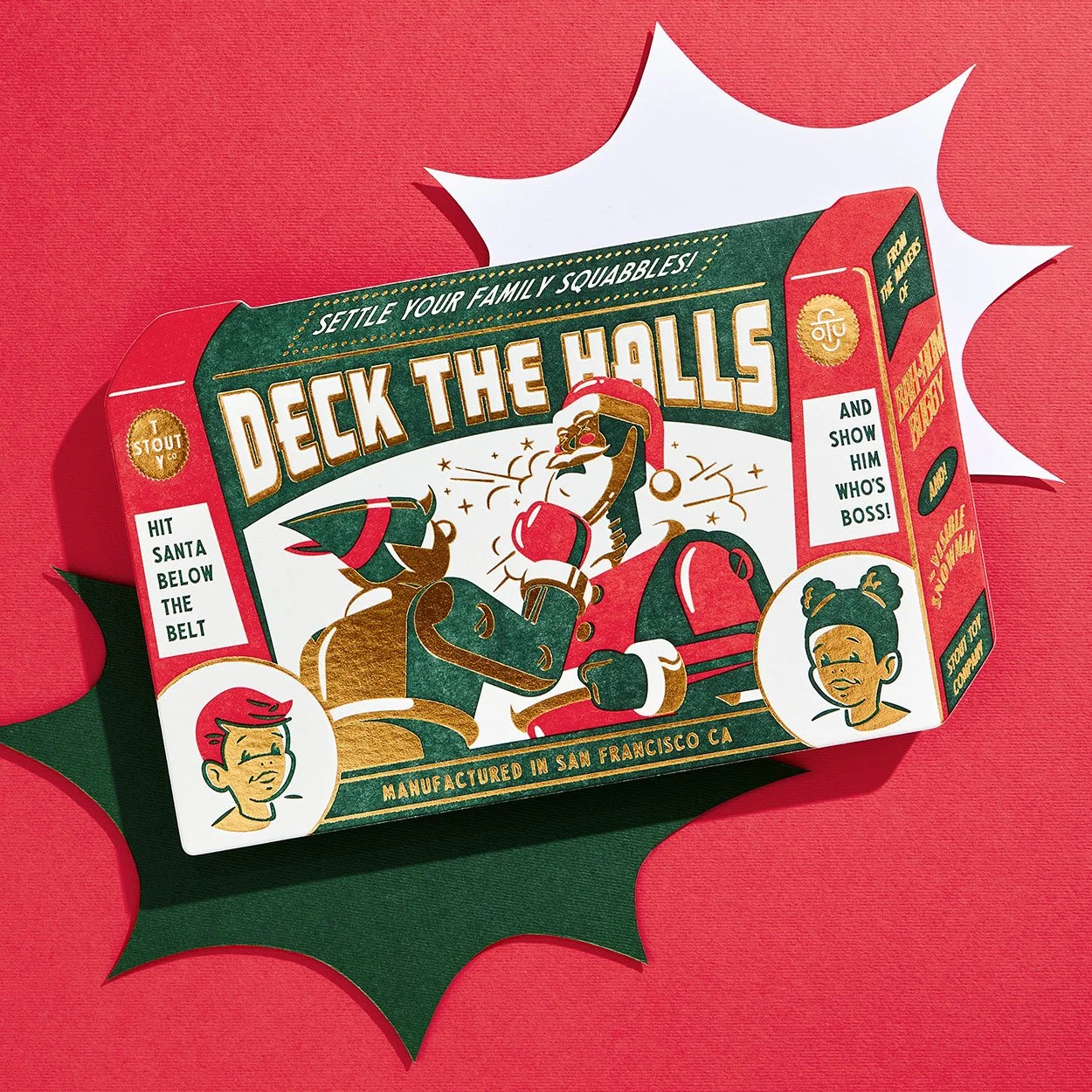 Illustrated game packaging with a vintage design. The box features a humorous depiction of Santa Claus and an elf wearing boxing gloves, titled "Deck the Halls." The background is red with green and white accents. The text suggests playful family squ
