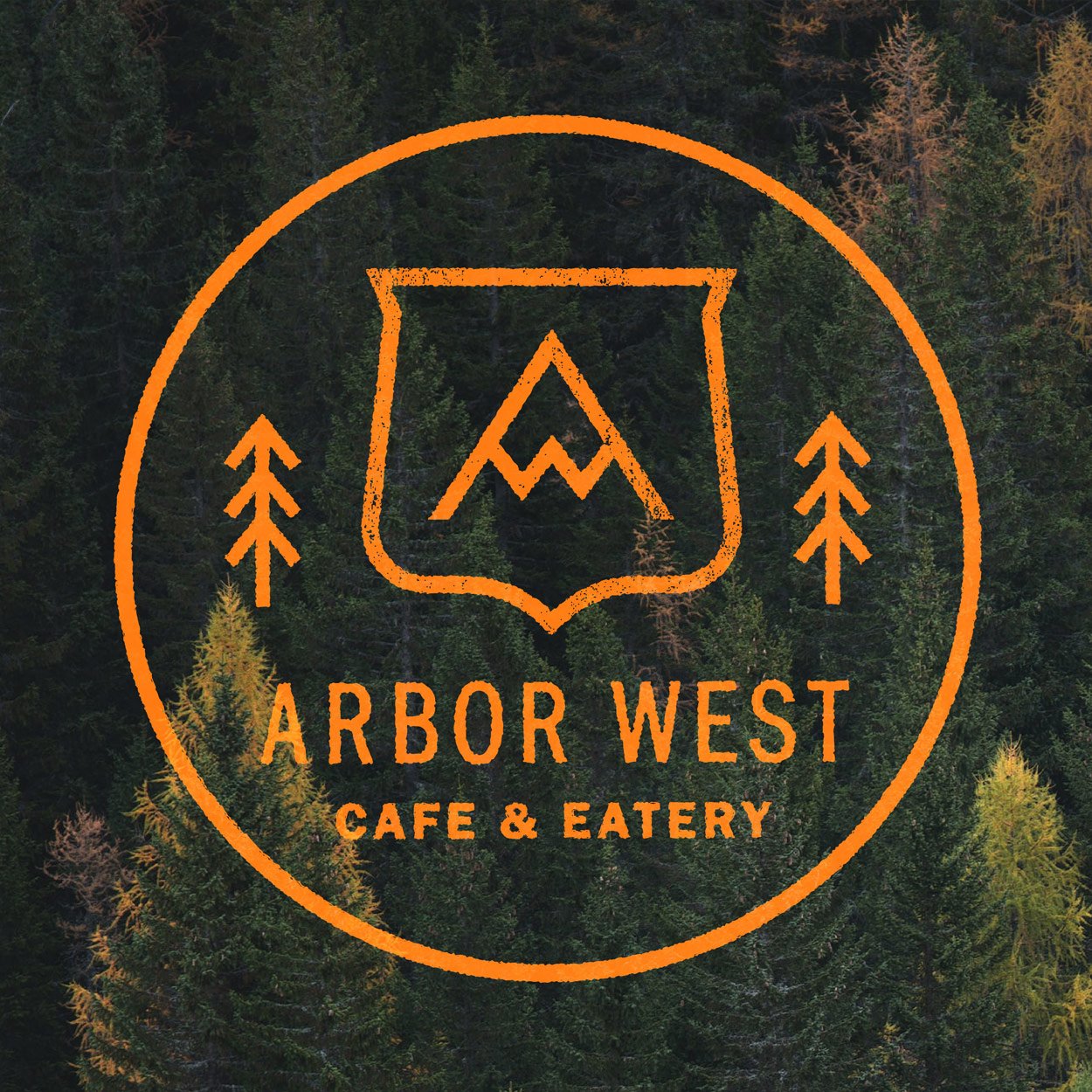 Logo of Arbor West Cafe & Eatery with orange design elements on a forest background, featuring stylized trees and a shield with a mountain graphic.