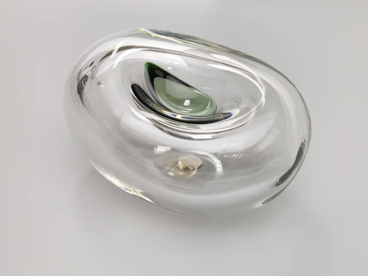  Zen Beans, 2012 (detail)   Glass .  8 x 5 in.   Contemplative pieces that suspend a sunken and elongated layer of melted colors. 