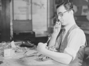 Glassblower Romeo Lefebvre in his workshop in Montreal, 1942.