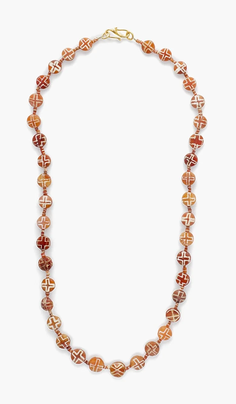 A Western Asiatic etched carnelian bead necklace . Circa late 3rd-early 2nd millennium B.C. 22⅝ in (57.5 cm) long. Estimate: $1,500-2,000. This lot is offered in Ancient Jewelry: Wearable Art , 29 November–8 December 2016, Online