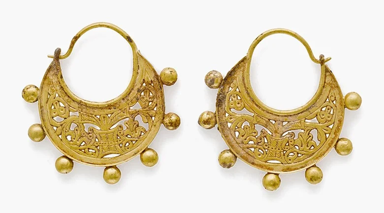 A pair of Byzantine gold crescentic earrings . Circa 9th century A.D. Each: 1¾ in (4.5 cm) long. Estimate: $5,000-7,000. This lot is offered in Ancient Jewelry: Wearable Art , 29 November–8 December 2016, Online