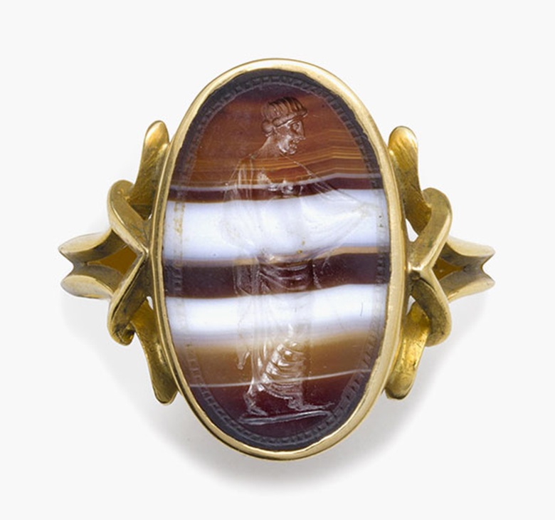 An italic banded agate ringstone with a partially draped goddess. Circa 2nd century B.C. ¾ in (1.9 cm) long; ring size 8½. Estimate: $3,000-5,000. This lot is offered in Ancient Jewelry: Wearable Art, 29 November–8 December 2016, Online