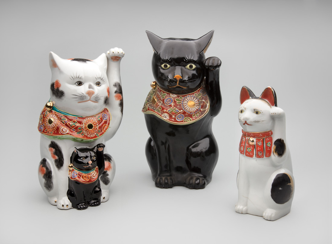 Left to right:Kutani kilns, Japan. Maneki neko with kitten 20th century, porcelain. Gift of Billie L. Moffitt. Mingei International Museum 2010-04-044 L2017.3201.011Kutani kilns, Japan. Maneki neko 20th century, porcelain. Gift of Billie L. Moffitt.…