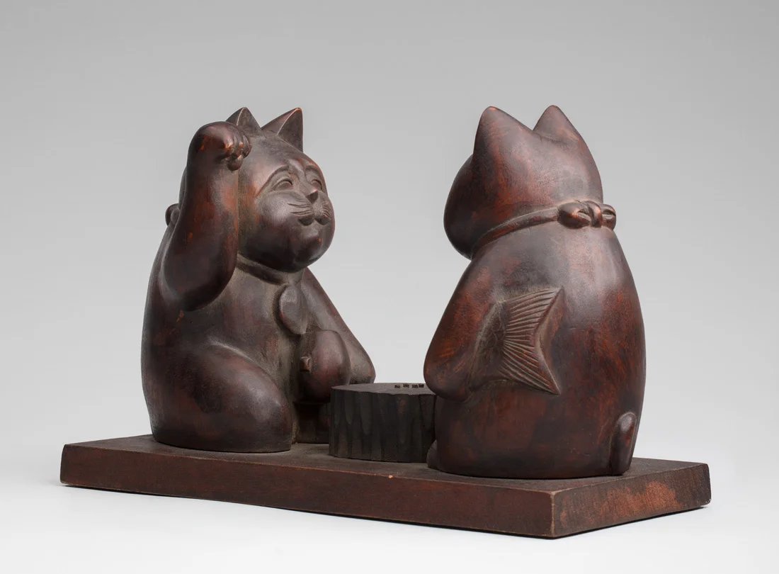 Maneki neko pair imitating the gods Daikoku and Ebisu playing Go 20th century, Japan. Wood. Gift of Billie L. Moffitt. Mingei International Museum 2010-04-145 L2017.3201.084