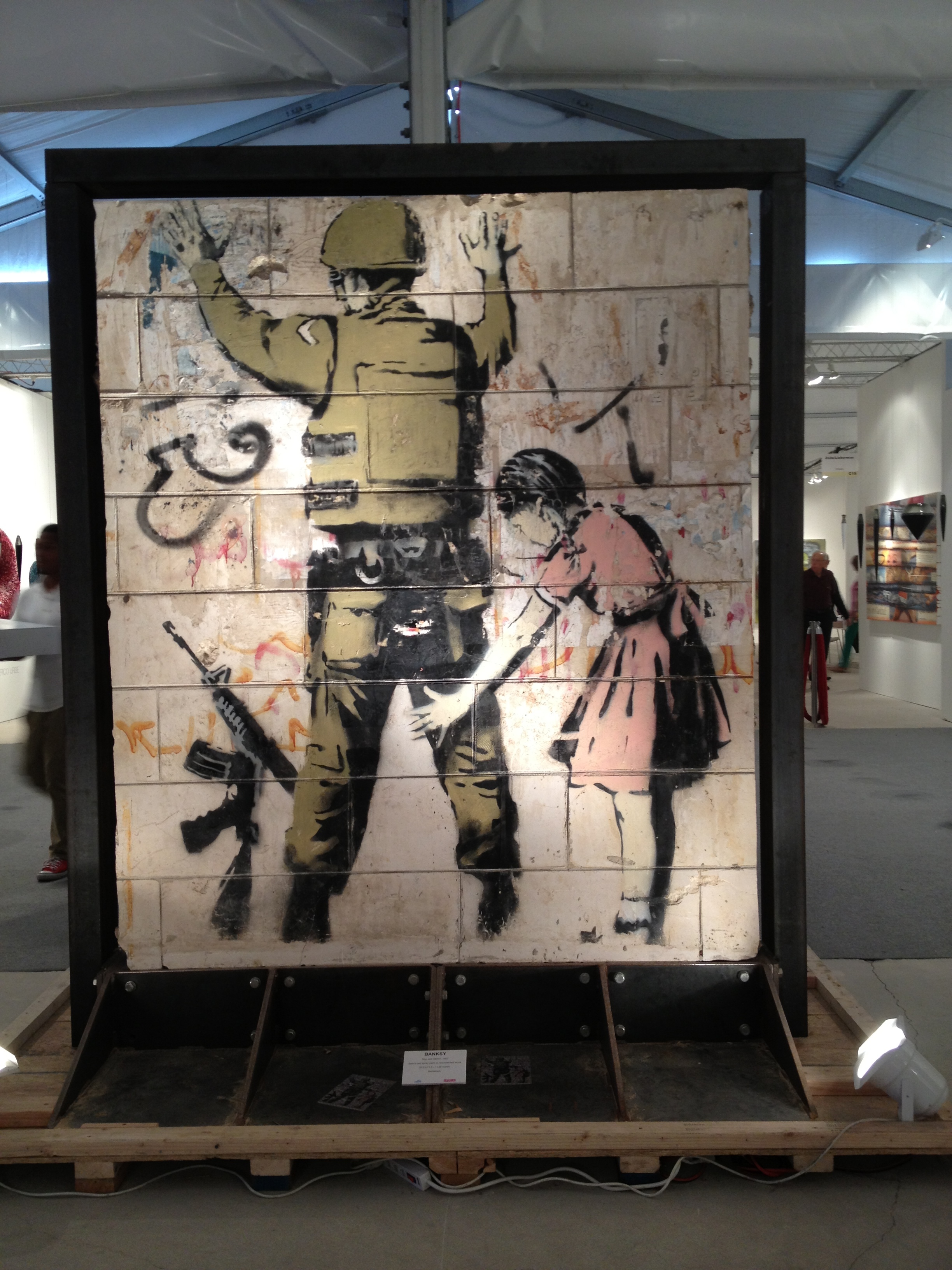 Banksy stenciled painting on wall section removed from Gaza Strip offered for sale at Art Basel|Miami. Photo ©Micaela van Zwoll.