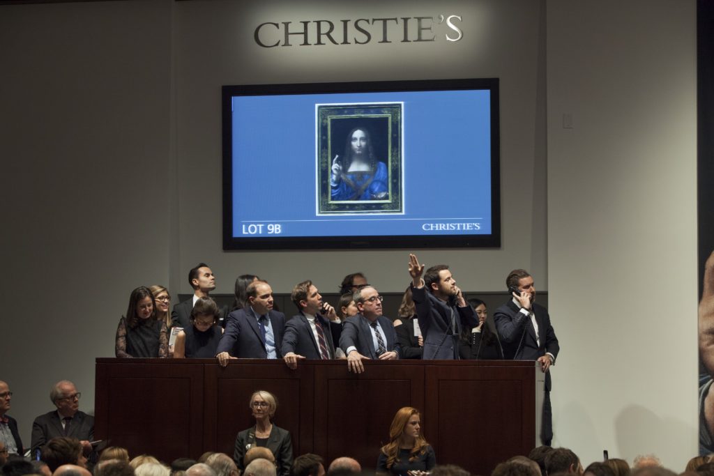 Loic Gouzer bidding on Leonardo's Salvator Mundi from the phone bank. Photo courtesy of Christie's.