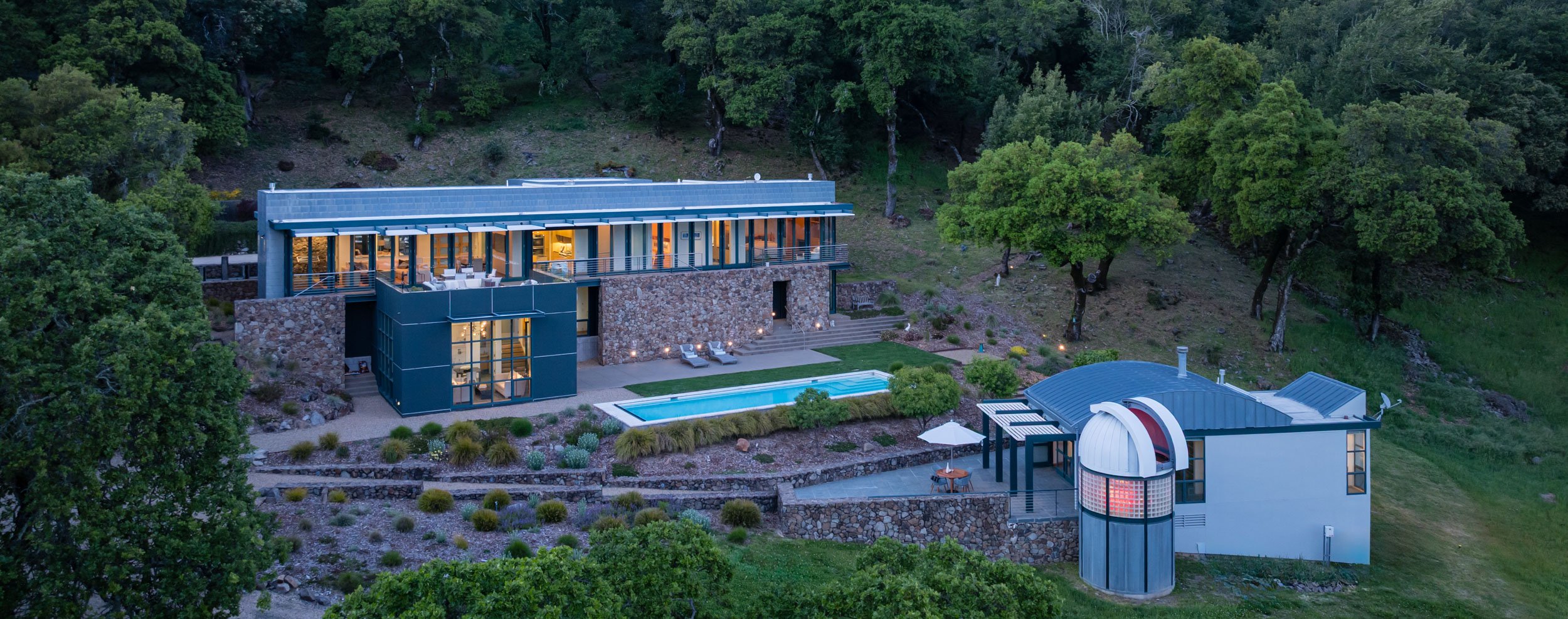 Aerial view showing the siting of an architect-designed Sonoma residence, with pool terrace and private observatory integrated into the hillside