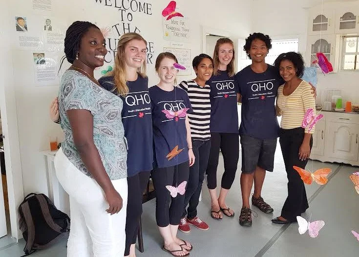 Managing Director of the Sunrise Center, Ms. Miriam Hinds-Roberts (left) and Madonna Adams (right) is seen here with some of the students of Queen's University during one of their training sessions at the Center in Zorg-en-Vlygt.