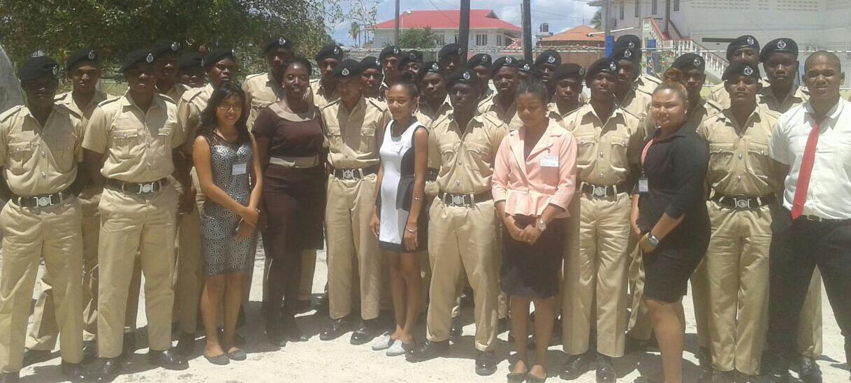 Sunrise Center Manager, Miriam Hinds poses with staff and volunteers of the center as well as police cadets from the training college.