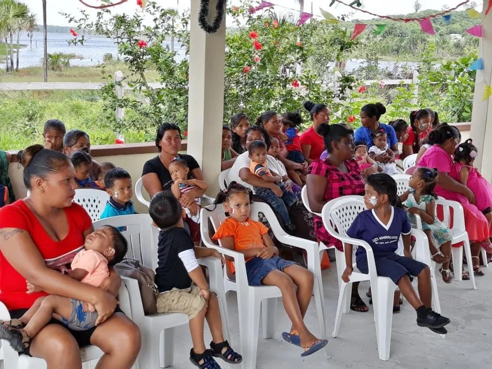 A section of the children and with their parents at the party at Mashabo village.