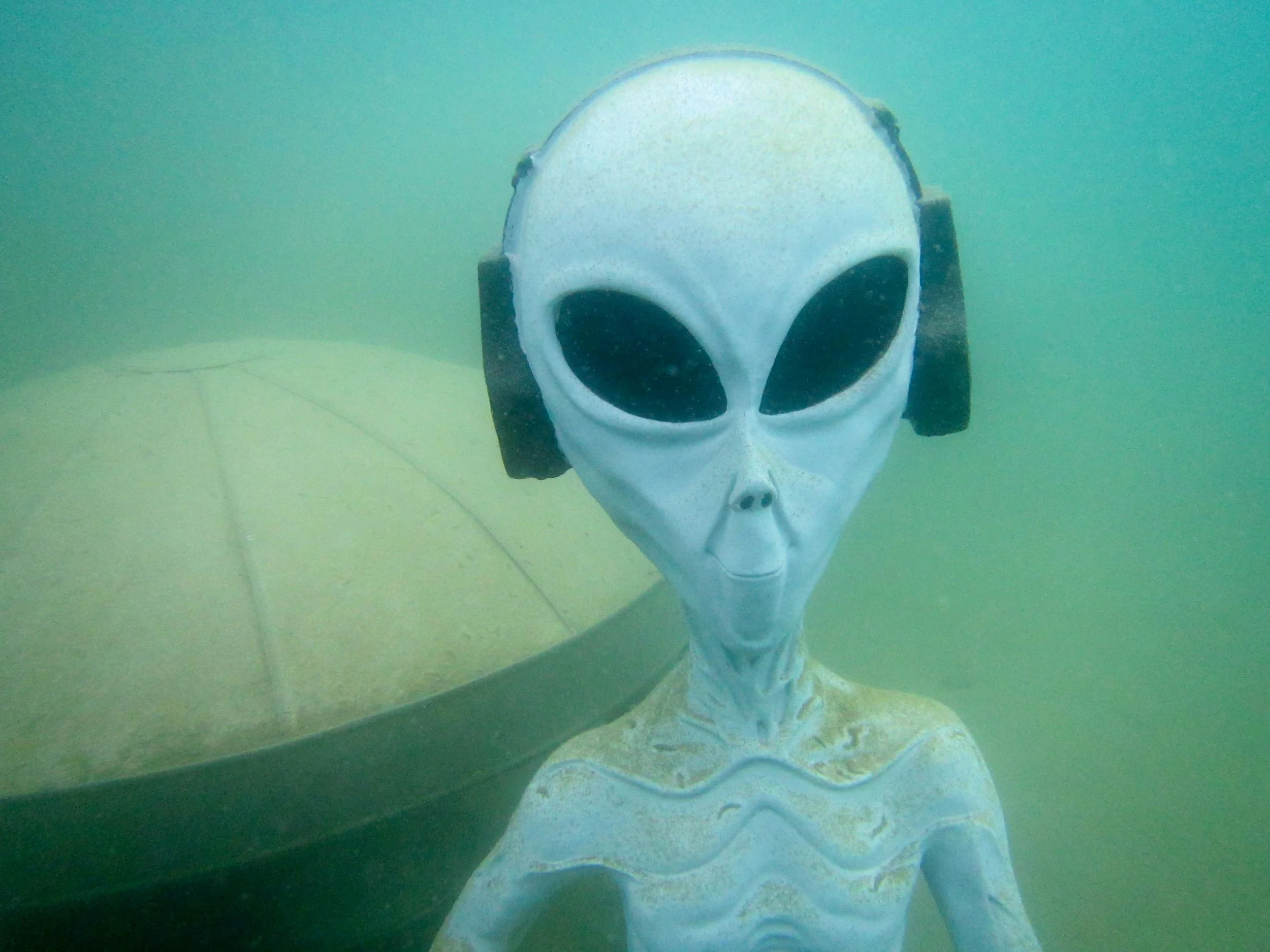 Little green Man and his spaceship at the bottom of the lake.