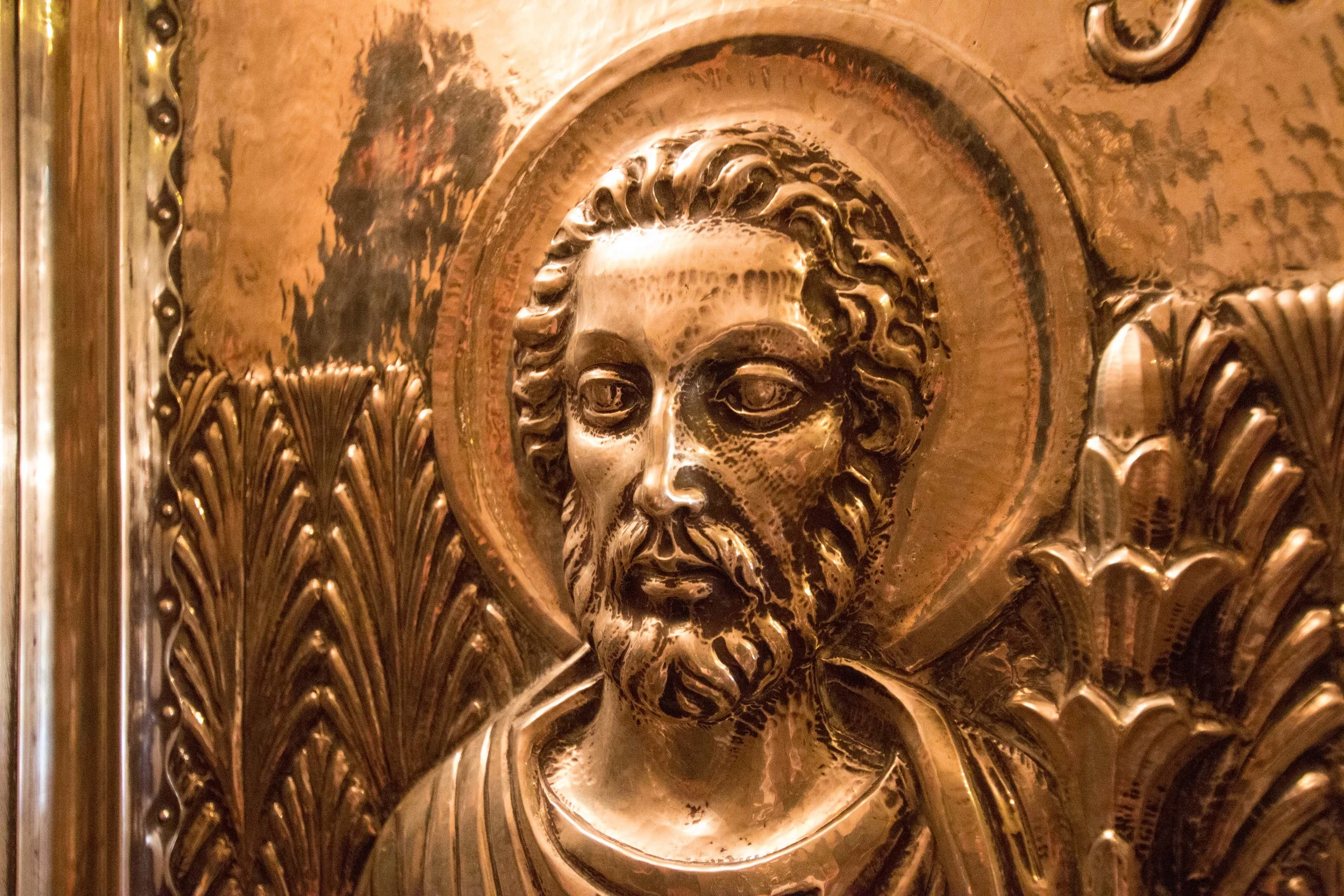 Carving on the door protecting the small set of stairs to the Madonna