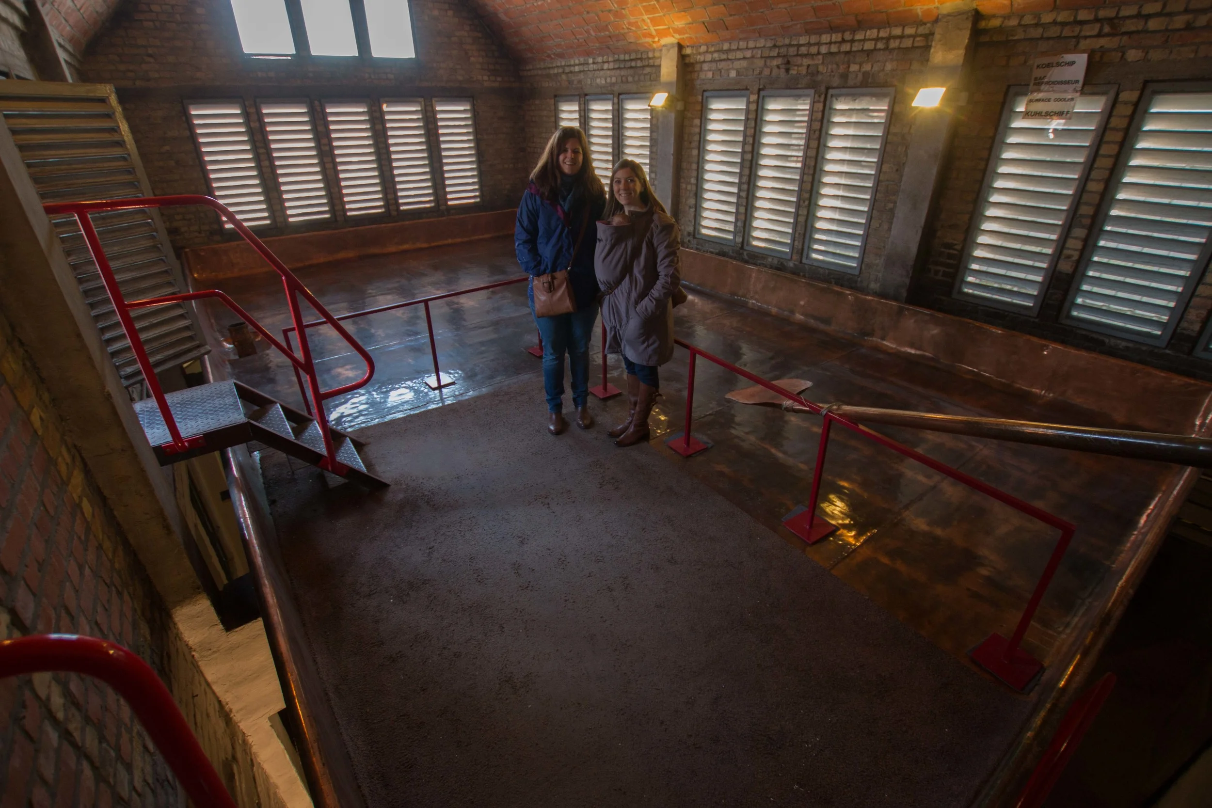 Kelsey, Evelyn , and I on top of the copper fermenter 
