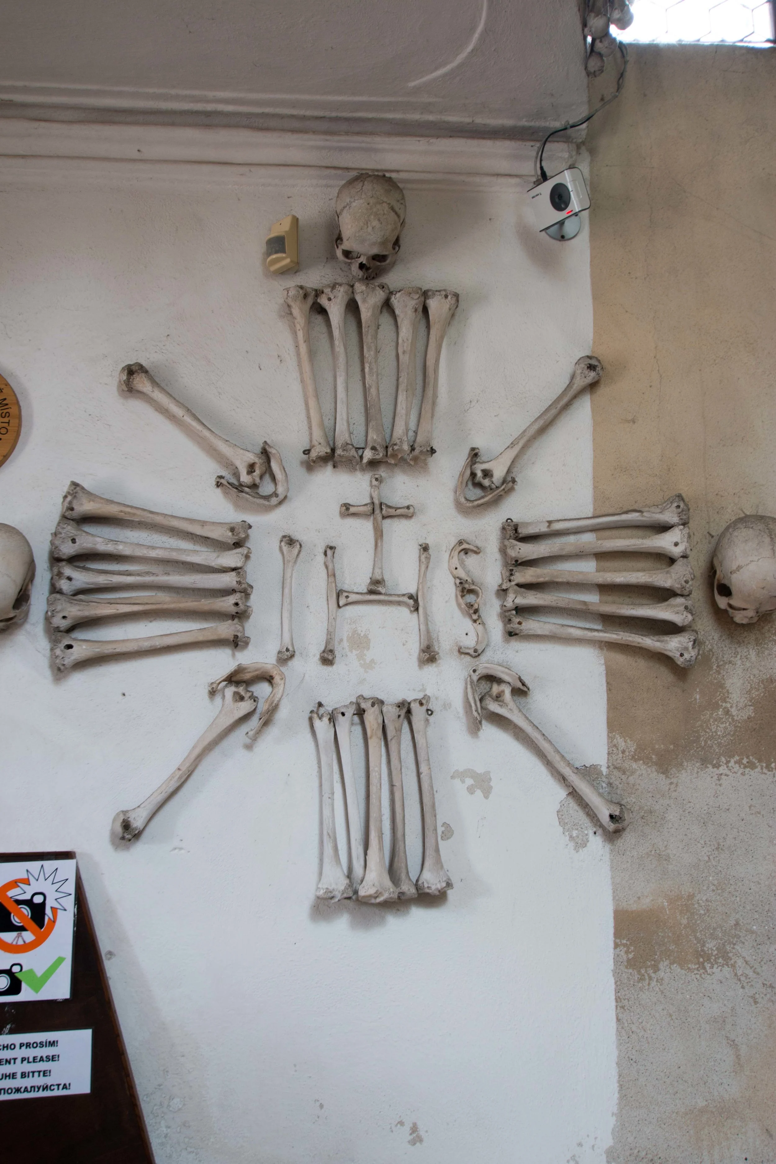 Human bones adorn even the walls while a security camera keeps an eye on visitors