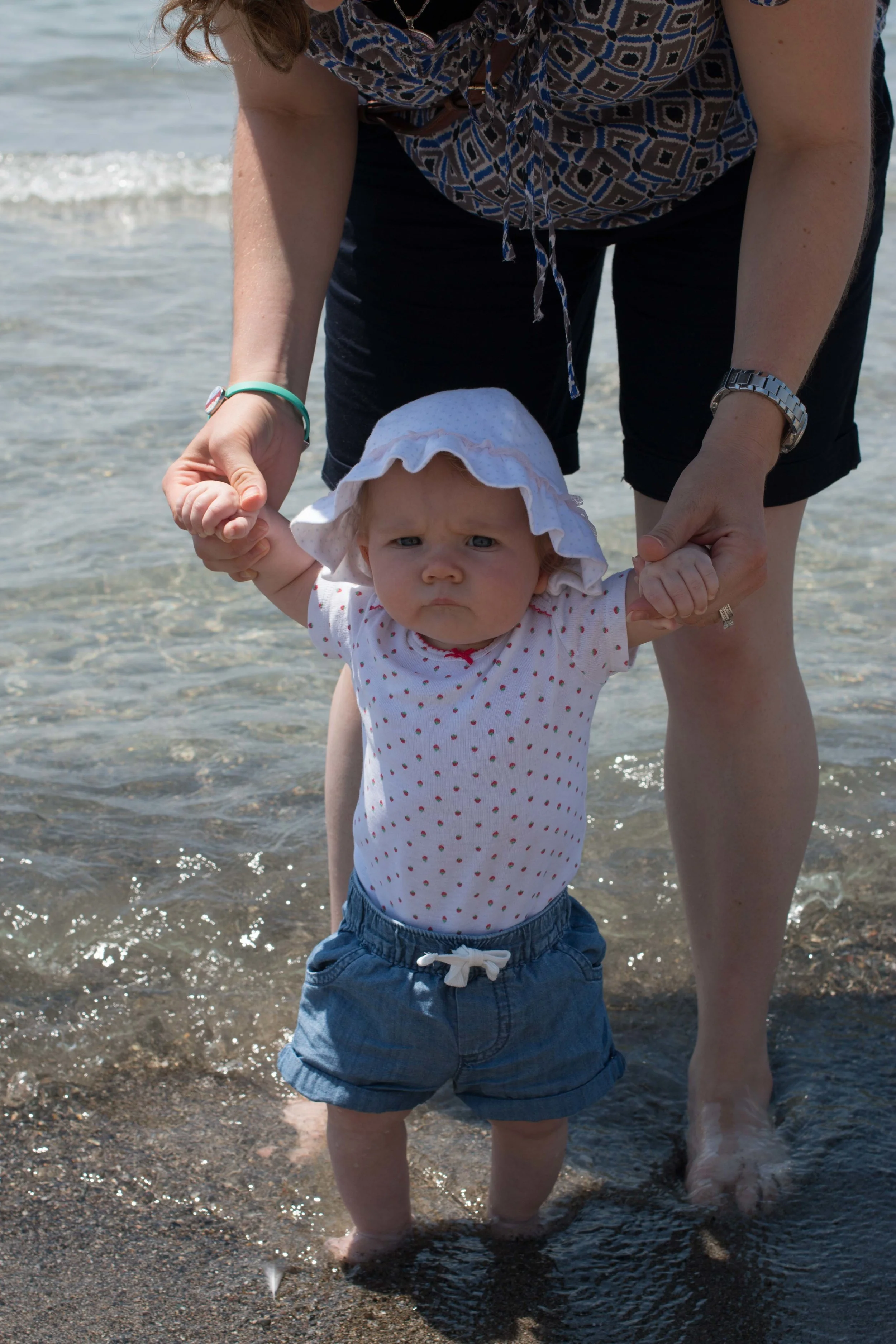 She wasn't digging the cold water of the mediterranean, but that pout is so cute!