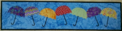 Quilt Art- Dancing Umbrellas, original design, made and quilted by RM, 2015