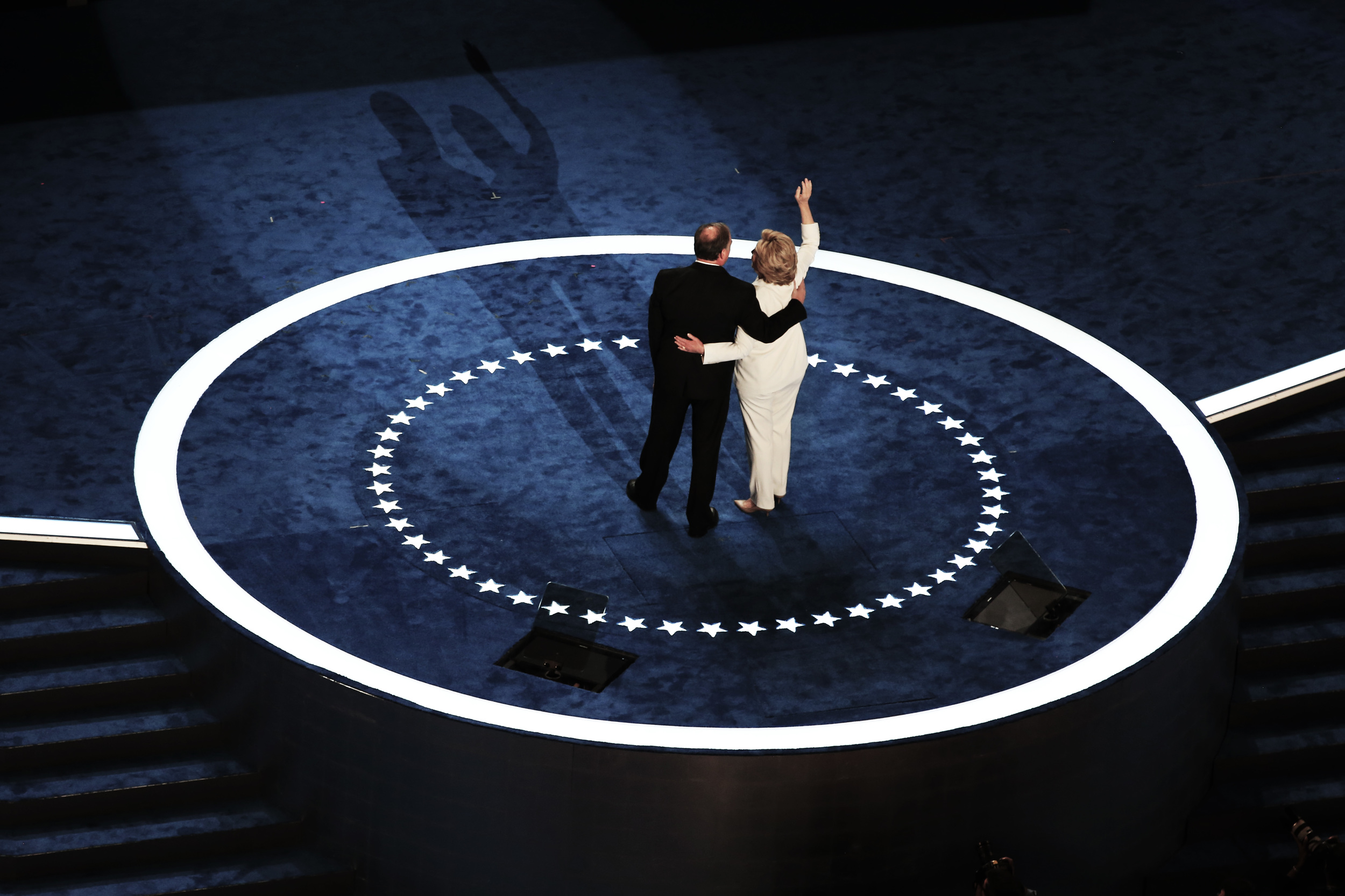  Democratic nominee Hillary Clinton and her running mate Tim Kaine wave to photographers on stage at the Democratic National Convention in Philadelphia after Clinton became the first woman to accept a major political party's nomination for President 